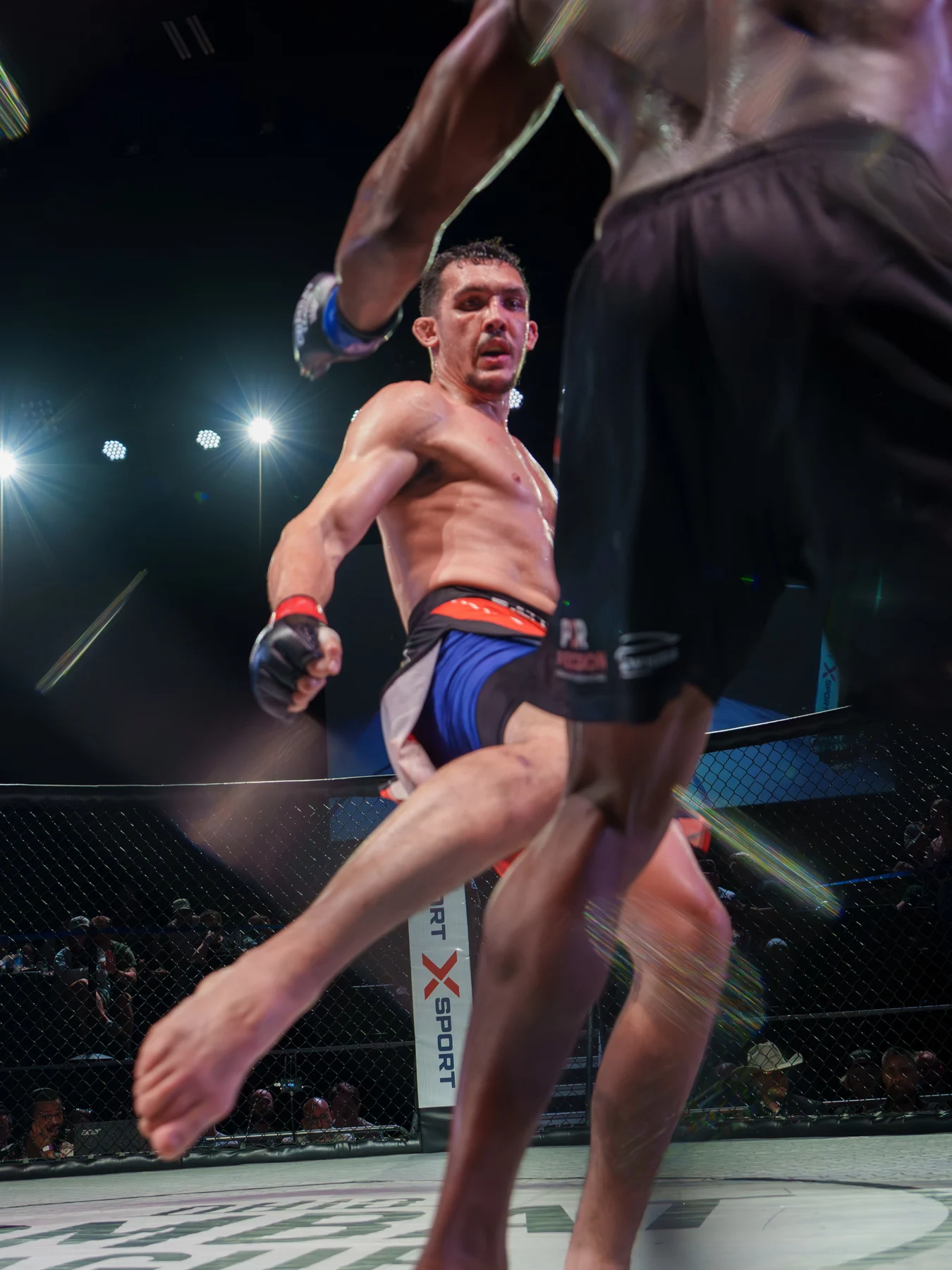 Ethan Riley throwing a kick against Terry Wiggins at Ohio Combat League 45