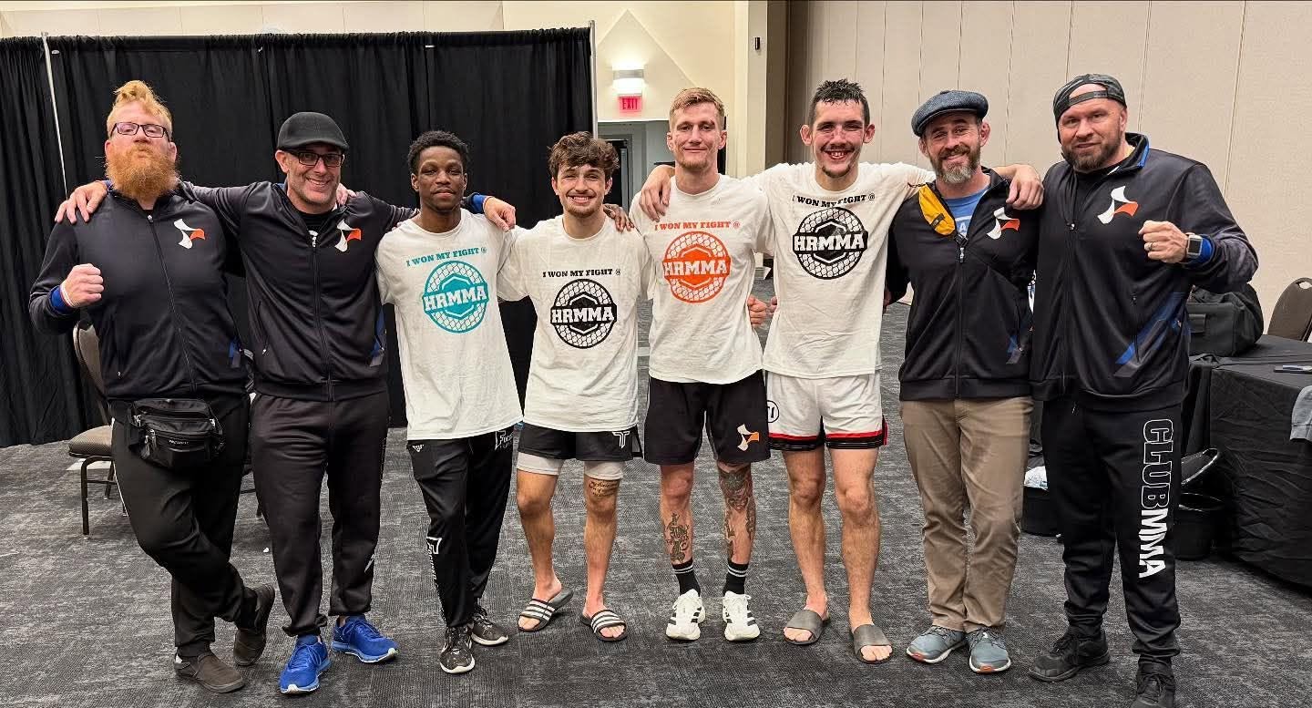 Ethan Riley with Club MMA fighters and coaches after a fight event